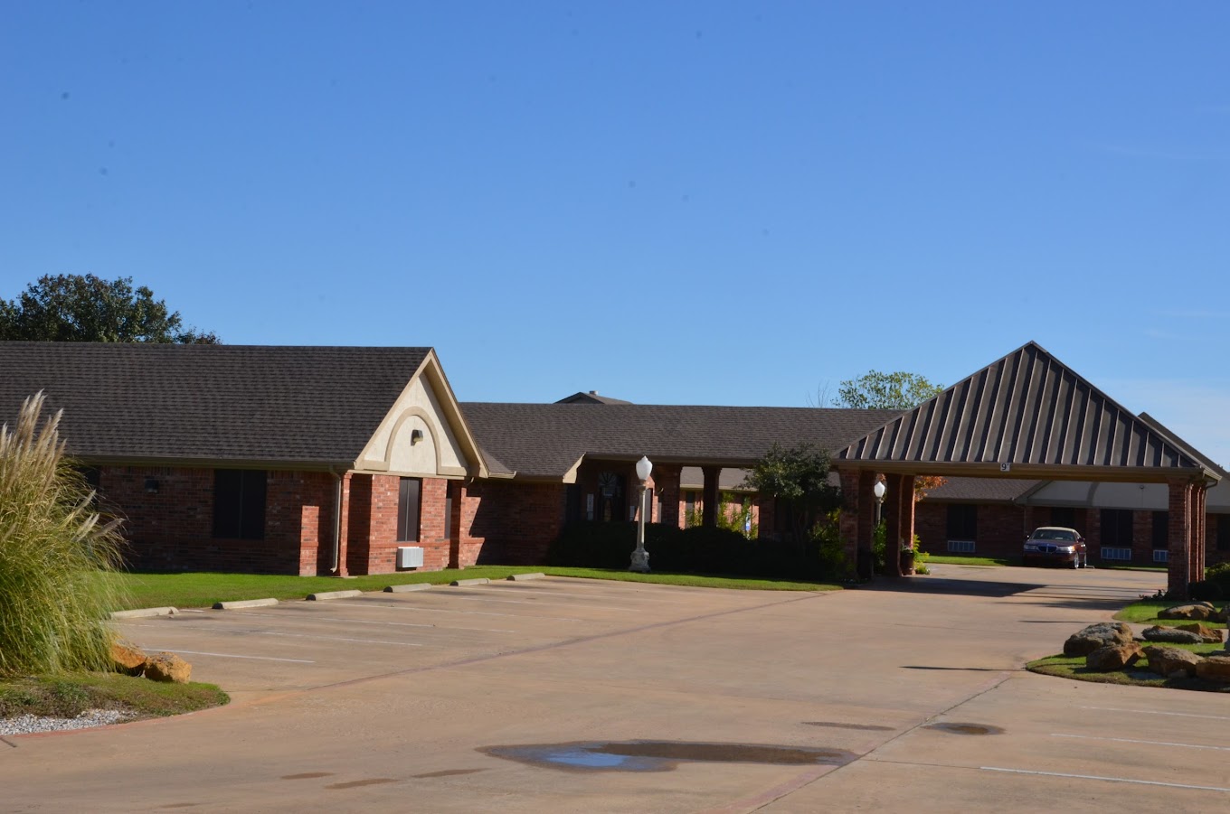 Exterior entrance of Homestead of Denison senior living community, Denison, TX